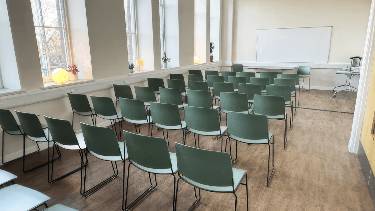 Big Links room set out theatre-style, a bright wide room overlooking Leith Links